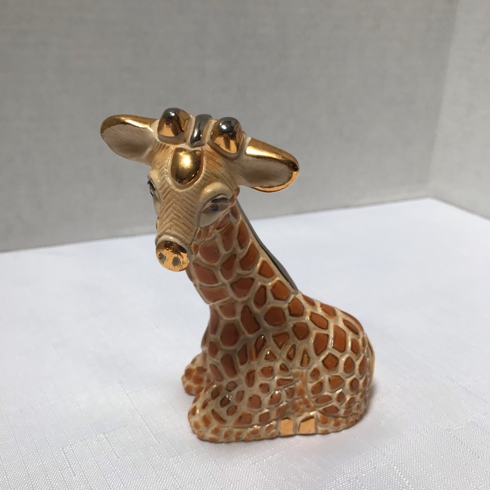 Collectible Giraffe figurine. Stamped on bottom.